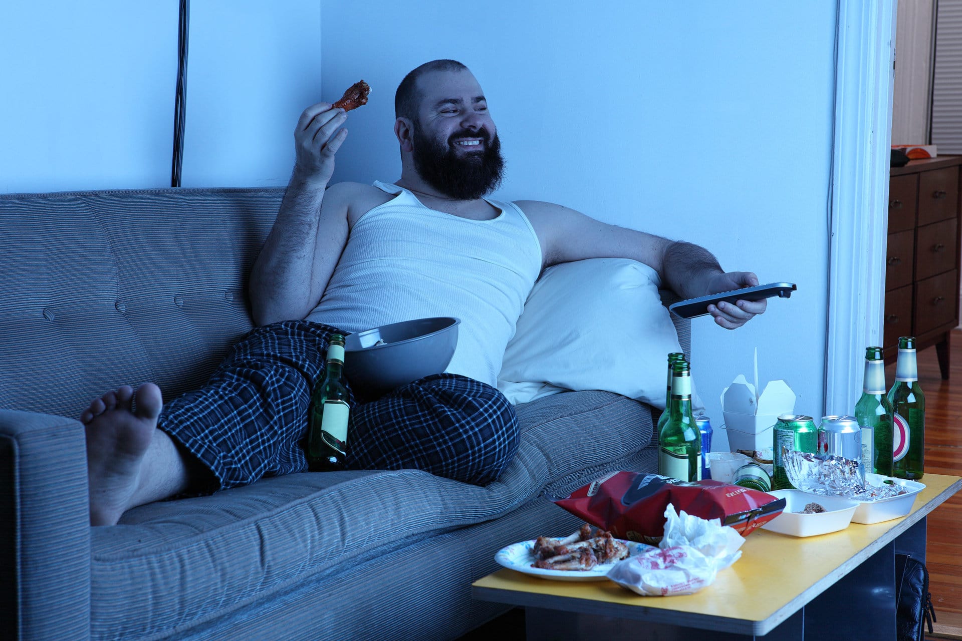 couch-potato-man-with-tv-remote-capx